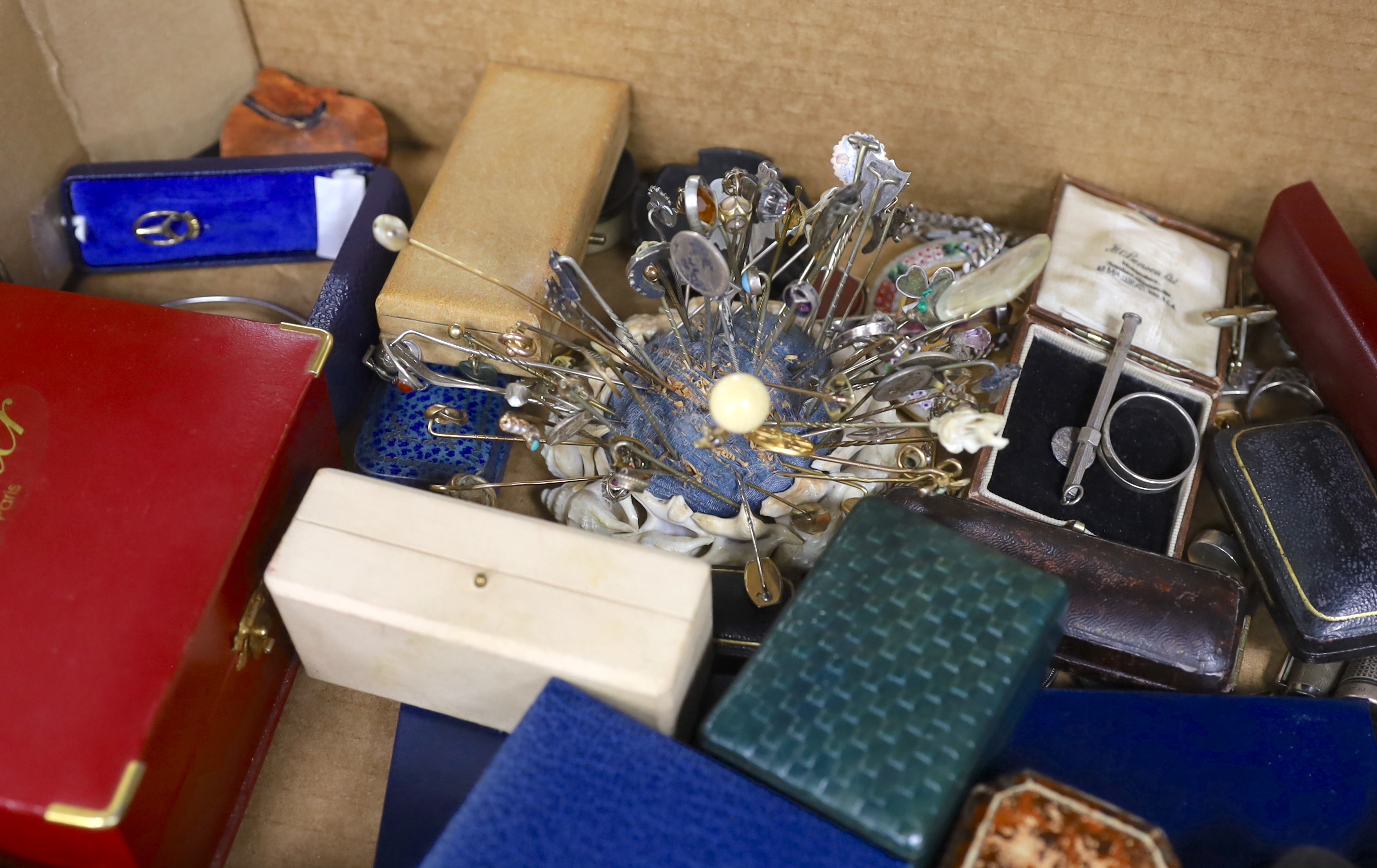 A large quantity of assorted collectables and curios including stick pins, brooches, pens, Links silver cufflinks, coins, jewellery boxes including two Cartier, rings, pendants etc.